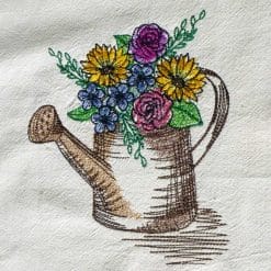 Watering can and spring flowers machine embroidery